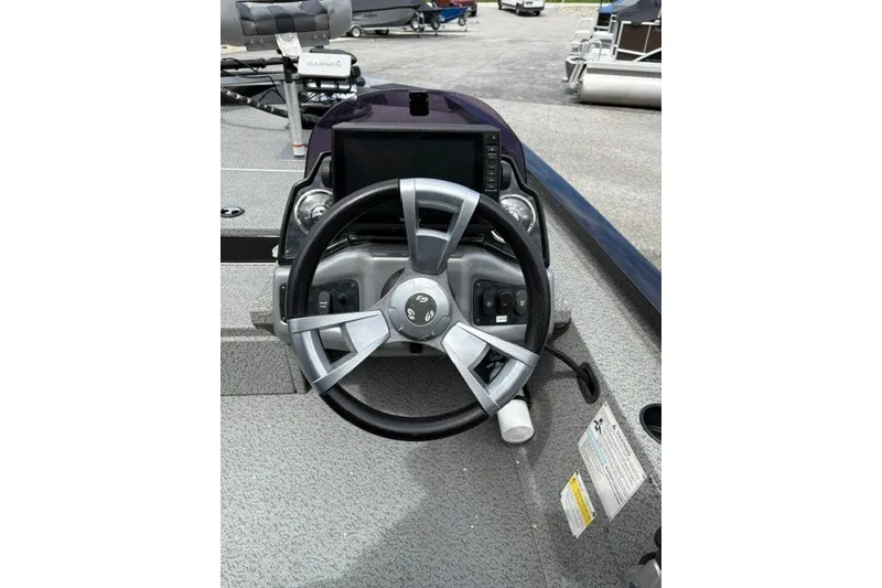 Slide: The Image of Steering wheel of 2020 G3 Sportsman 1710 boat with dashboard controls. - 5