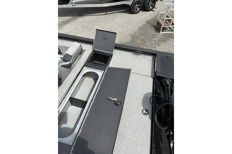 Slide: The Image of 2020 G3 Sportsman 1710 boat interior with open storage compartments. - 9