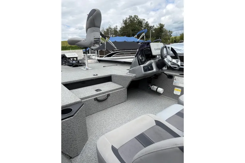 Slide: The Image of 2020 G3 Sportsman 1710 boat interior with steering wheel and seating. - 16