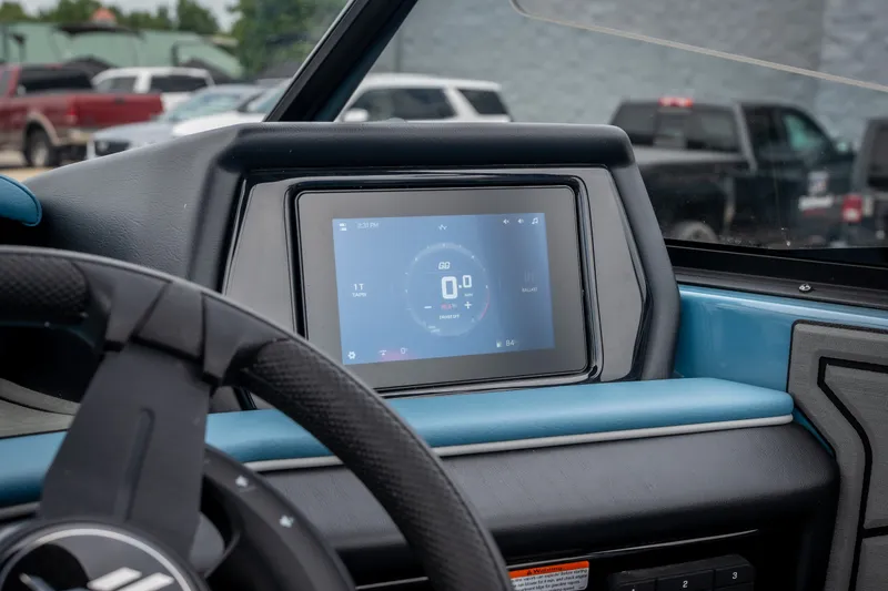 Slide: The Image of Dashboard of 2026 ATX Surf Boats 22 Type-S with digital display and steering wheel. - 12