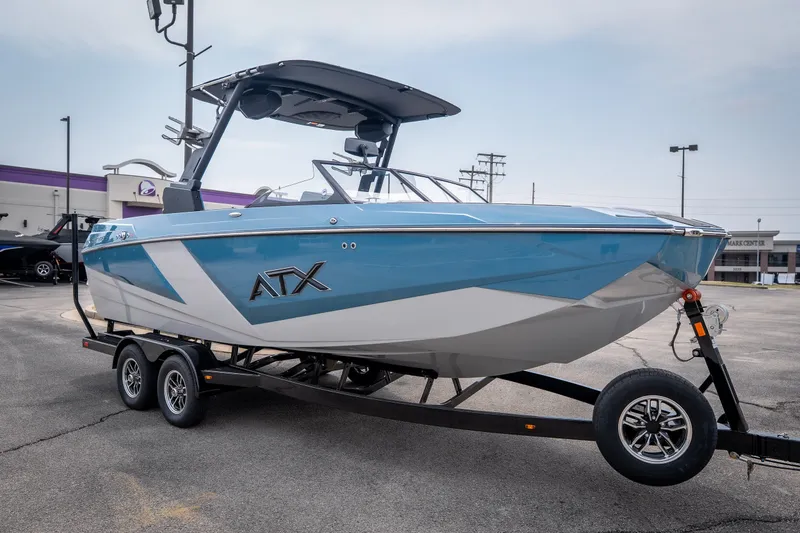 Slide: The Image of 2026 ATX Surf Boats 22 Type-S in blue and white on a trailer. - 32