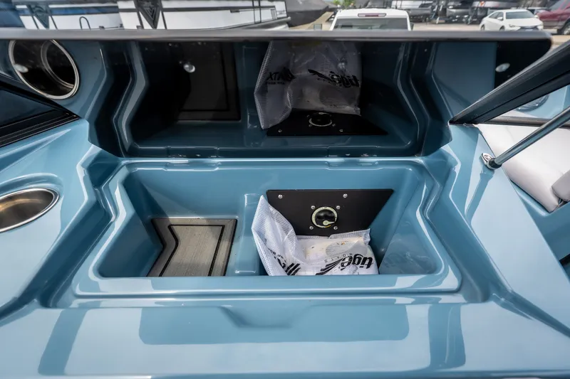 Slide: The Image of 2026 ATX Surf Boats 22 Type-S interior storage compartments in sleek blue finish. - 11