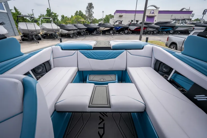 Slide: The Image of 2026 ATX Surf Boats 22 Type-S interior with blue and white seating, showcasing luxury design. - 27