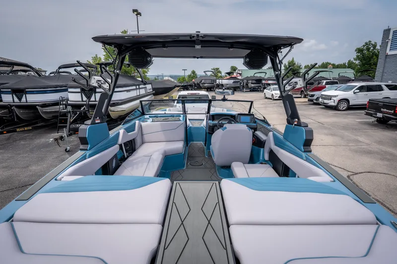 Slide: The Image of 2026 ATX Surf Boats 22 Type-S with spacious seating and modern design in a dealership lot. - 5