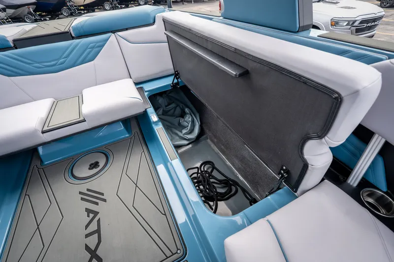 Slide: The Image of 2026 ATX Surf Boats 22 Type-S interior with open storage compartment and seating. - 24