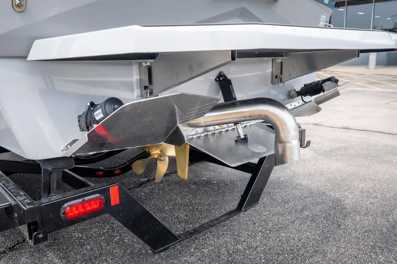 Slide: The Image of Rear view of 2026 ATX Surf Boats 22 Type-S, showcasing propeller and exhaust system. - 38