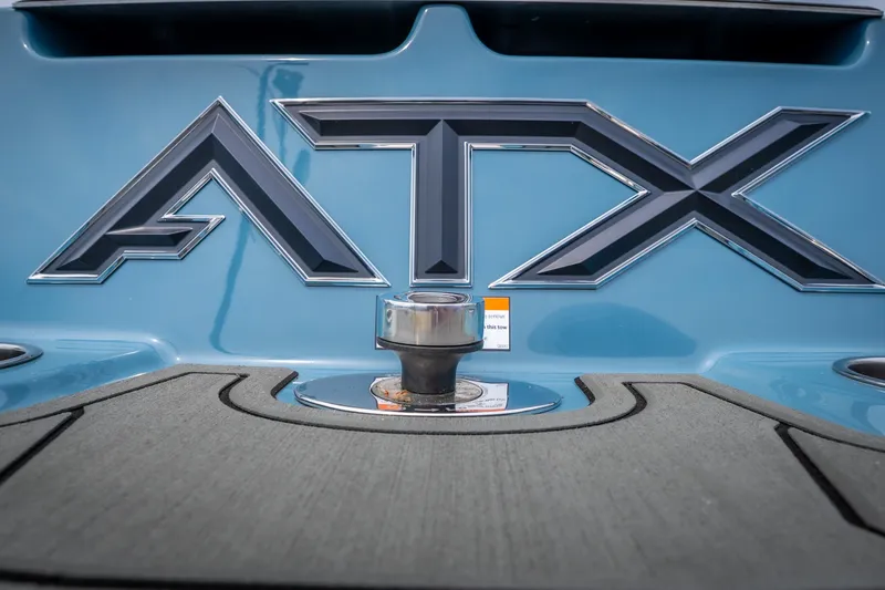 Slide: The Image of Close-up of 2026 ATX Surf Boats 22 Type-S logo on blue surface. - 4