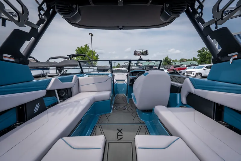 Slide: The Image of 2026 ATX Surf Boats 22 Type-S interior with blue and white seating, modern design. - 10