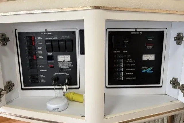 Slide: The Image of Electrical control panel on a 1999 Sea Ray Sundancer 310 boat. - 37