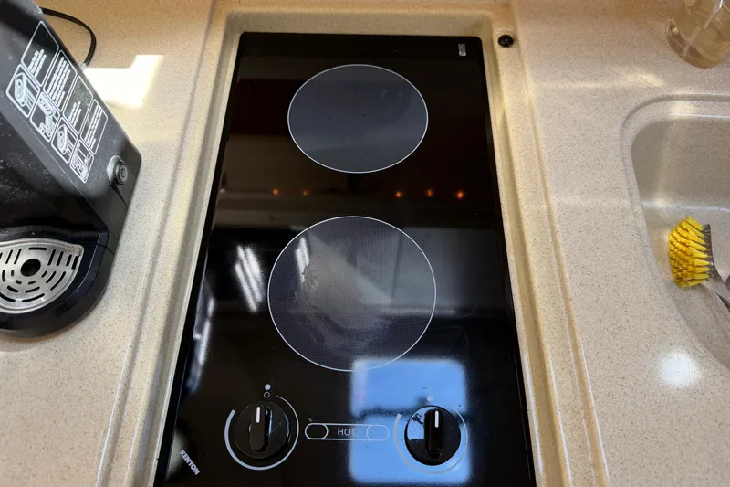 Slide: The Image of Built-in stovetop on 1999 Sea Ray Sundancer 310 yacht kitchen counter. - 27