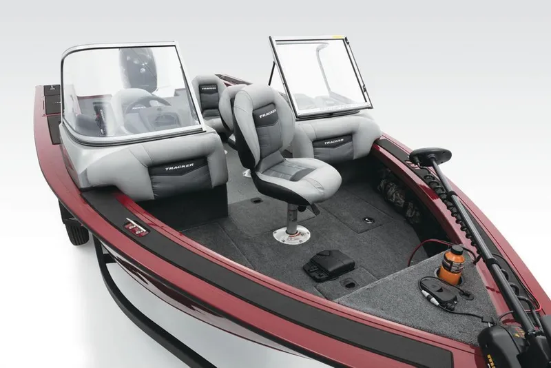 Slide: The Image of A 2017 Tracker Targa V-18 Combo with two cushioned seats and windshields on gray carpeting. - 20