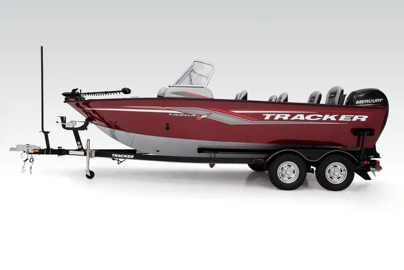 Slide: The Image of A red 2017 Tracker Targa V-18 Combo boat on a trailer, featuring a Mercury engine. - 49