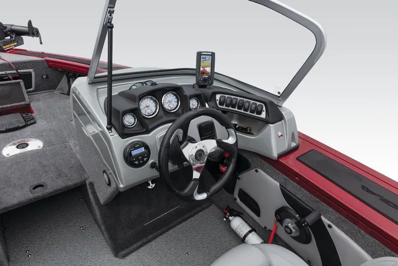 Slide: The Image of The image shows the cockpit of a 2017 Tracker Targa V-18 Combo with gray interior and steering console. - 37