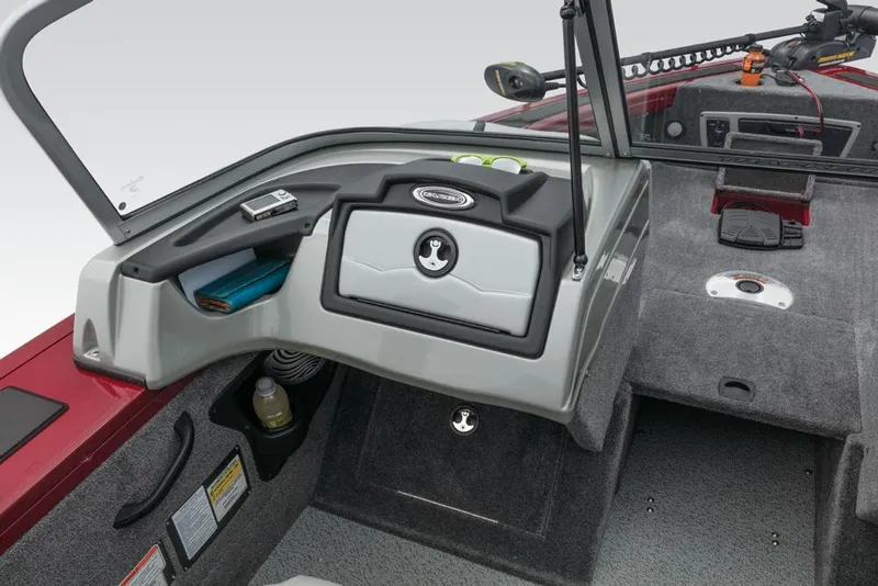 Slide: The Image of The image shows the cockpit of a 2017 Tracker Targa V-18 Combo boat with gray interior. - 32