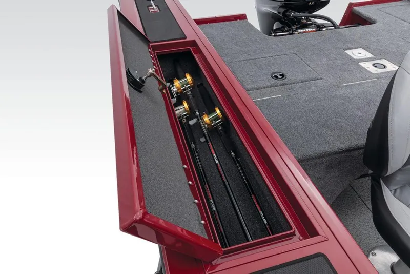 Slide: The Image of The image shows a red fishing rod holder on a boat with gray carpet flooring. - 39