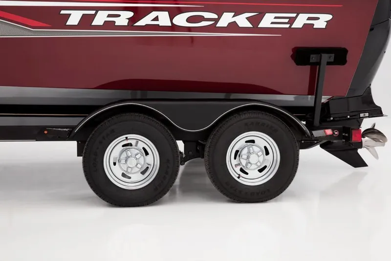 Slide: The Image of Close-up of a boat trailer with two wheels and the word "Tracker" on the boat. - 42