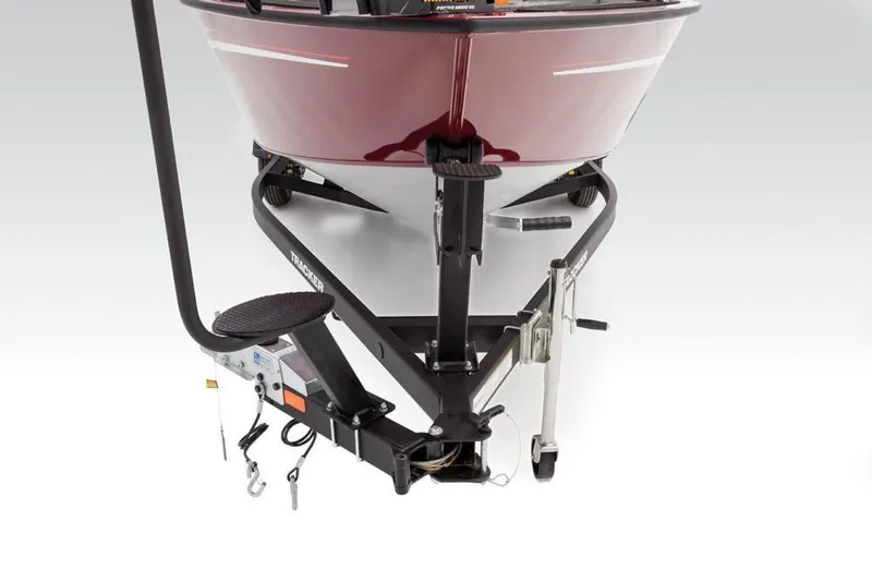 Slide: The Image of Close-up of the bow of a red Tracker Targa V-18 Combo boat on a trailer. - 44