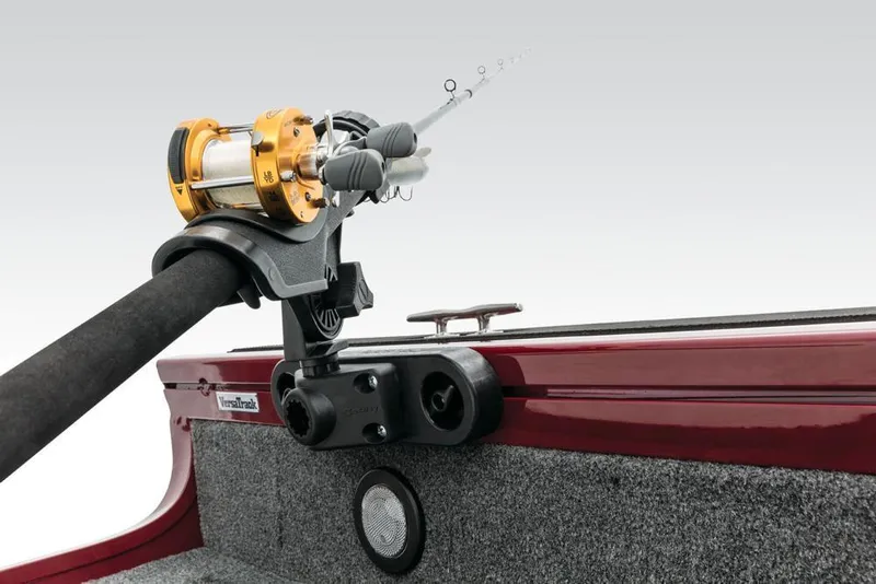 Slide: The Image of A fishing rod is secured in a holder on a boat. The hull is red. - 26