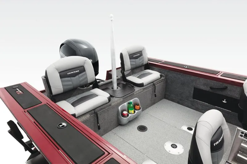 Slide: The Image of The image shows the cockpit of a 2017 Tracker Targa V-18 Combo boat with gray seats. - 14