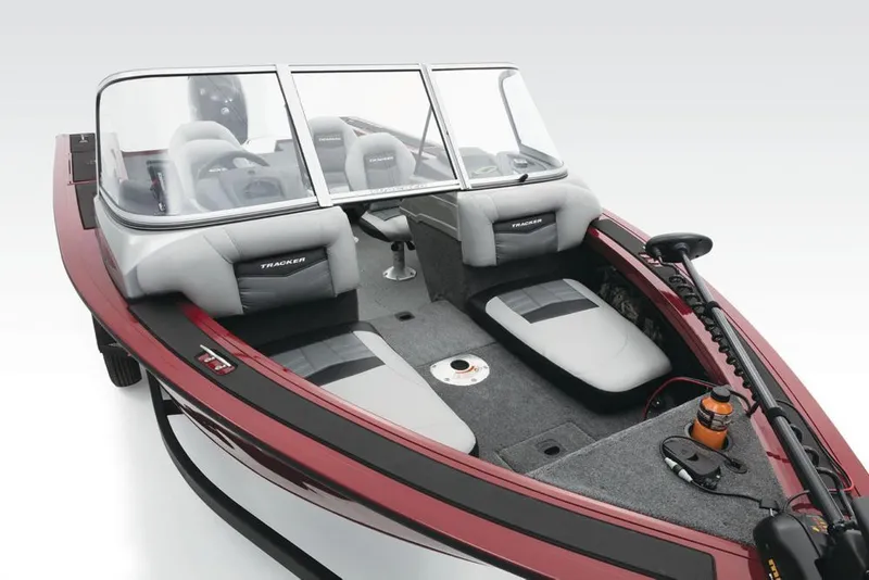 Slide: The Image of A 2017 Tracker Targa V-18 Combo with a red hull and gray seats. It features a windshield and fishing gear. - 17