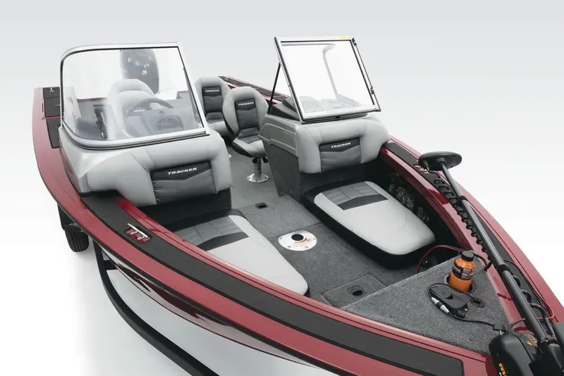 Slide: The Image of A 2017 Tracker Targa V-18 Combo with gray seating and red accents, featuring windshields. - 13