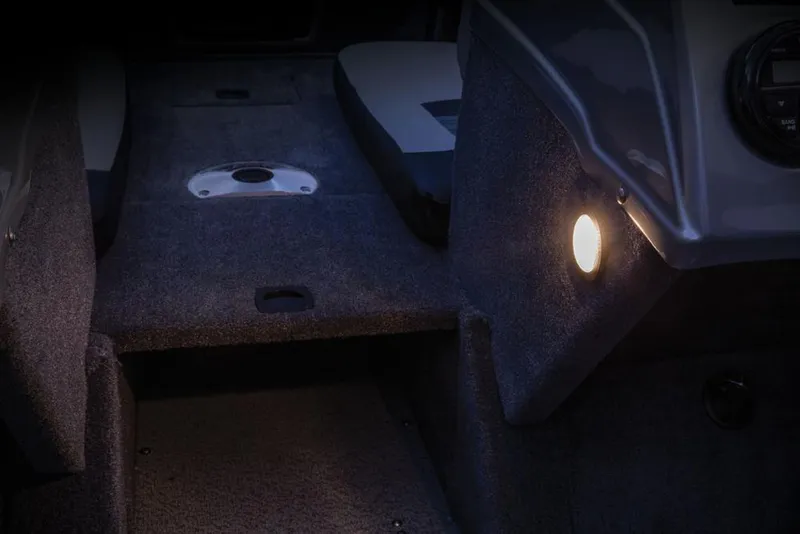 Slide: The Image of Interior of a 2017 Tracker Targa V-18 Combo with carpeted flooring and lighting. - 18