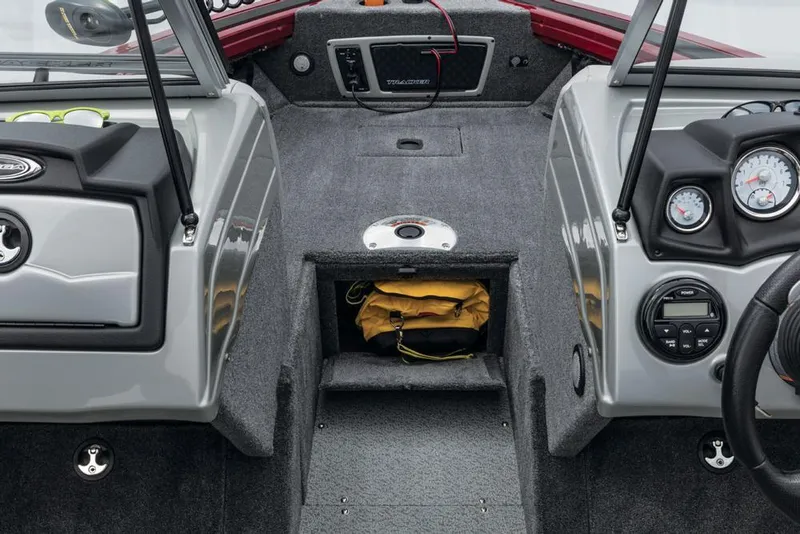 Slide: The Image of The image shows the cockpit of a 2017 Tracker Targa V-18 Combo with gray carpeting and instrument panels. - 24