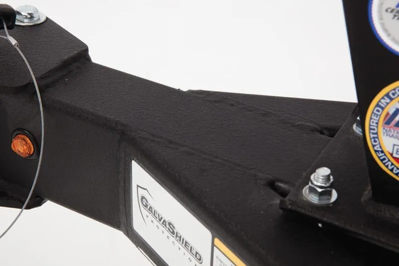 Slide: The Image of Close-up of a black boat trailer with stickers and bolts. - 47