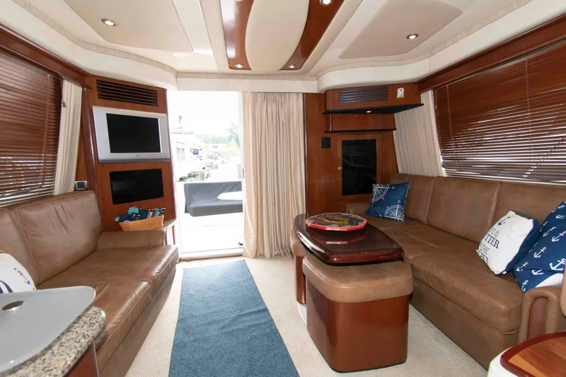 Slide: The Image of Luxurious interior of 2006 Sea Ray 44 Sedan Bridge yacht with leather seating and modern amenities. - 18