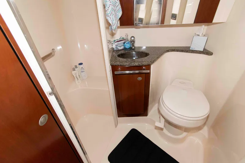 Slide: The Image of Luxurious bathroom in 2006 Sea Ray 44 Sedan Bridge yacht with shower and sink. - 20