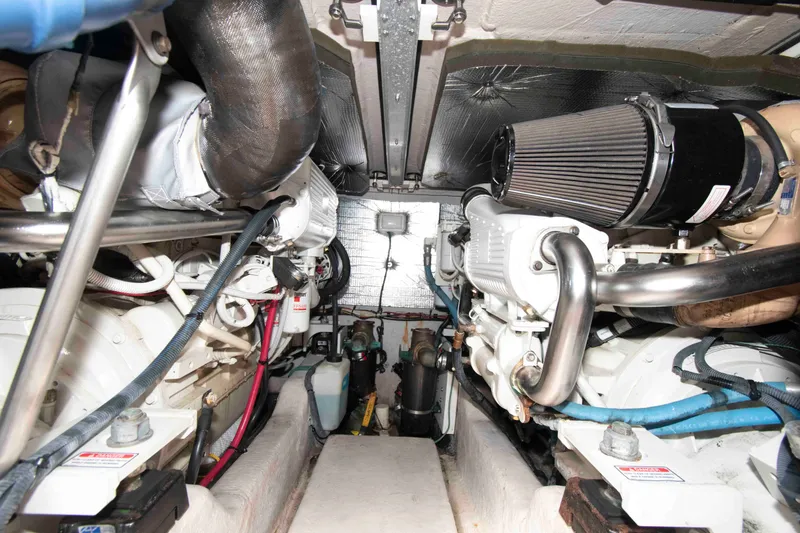 Slide: The Image of Engine room of a 2006 Sea Ray 44 Sedan Bridge yacht, showcasing dual engines. - 25