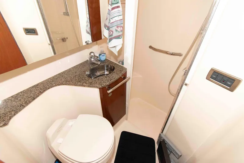 Slide: The Image of Luxurious bathroom in 2006 Sea Ray 44 Sedan Bridge yacht with granite countertop and shower. - 22