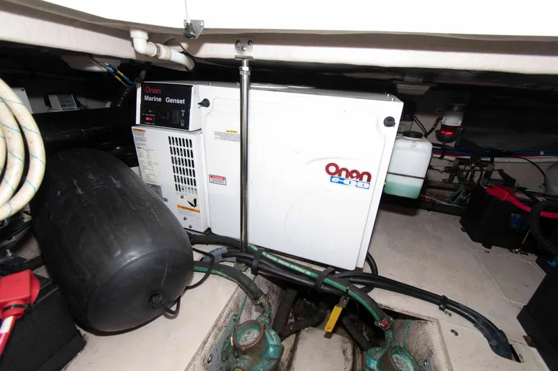 Slide: The Image of Engine room of 2006 Sea Ray 44 Sedan Bridge with Onan marine generator. - 28
