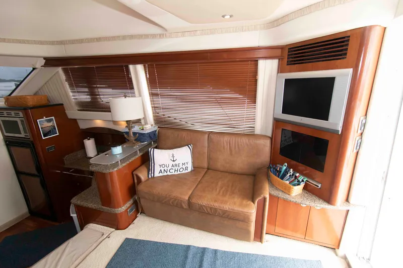 Slide: The Image of Interior of 2006 Sea Ray 44 Sedan Bridge with cozy seating and modern amenities. - 15