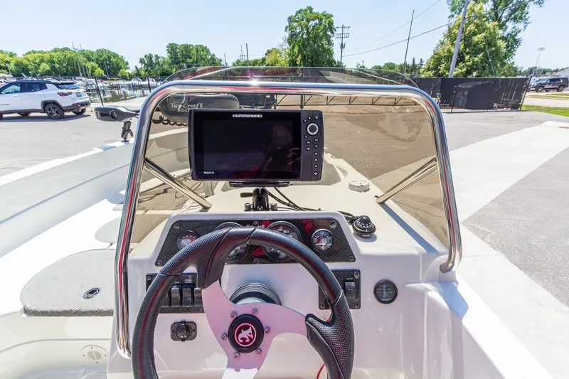 Slide: The Image of 2009 Yarcraft 1785 SC boat dashboard with steering wheel and Humminbird fishfinder. - 19