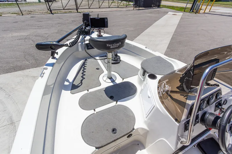 Slide: The Image of 2009 Yarcraft 1785 SC boat interior with seating and control panel. - 21