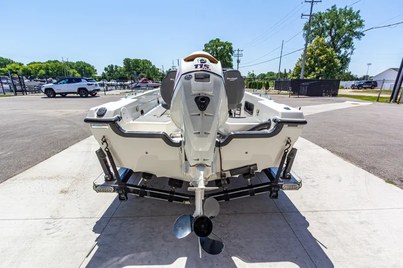 Slide: The Image of 2009 Yarcraft 1785 SC boat with outboard motor, parked on a sunny day. - 5