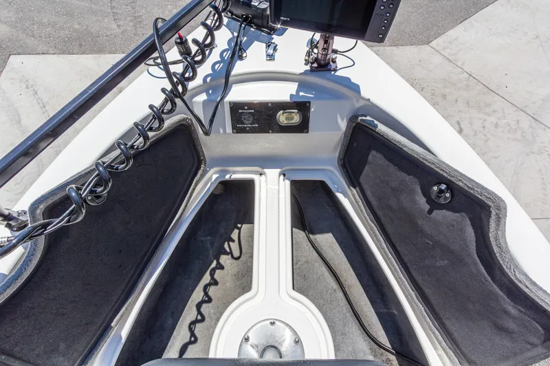 Slide: The Image of 2009 Yarcraft 1785 SC boat interior with storage compartments and electronic equipment. - 26