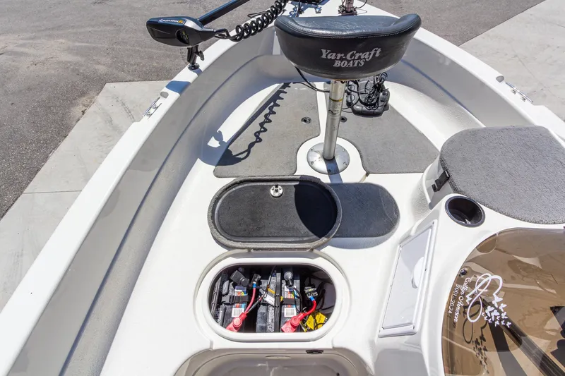 Slide: The Image of 2009 Yarcraft 1785 SC boat interior with battery compartment and seating. - 22
