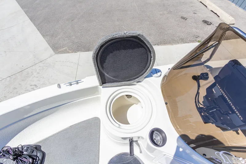 Slide: The Image of 2009 Yarcraft 1785 SC boat interior with open storage compartment and electronics. - 25