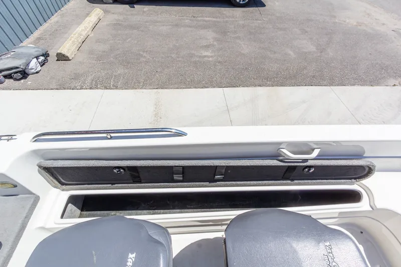 Slide: The Image of 2009 Yarcraft 1785 SC boat interior with storage compartment and seating. - 15