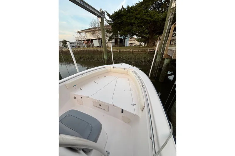 Slide: The Image of 2006 Grady-White Advance 257 boat docked near waterfront property. - 5