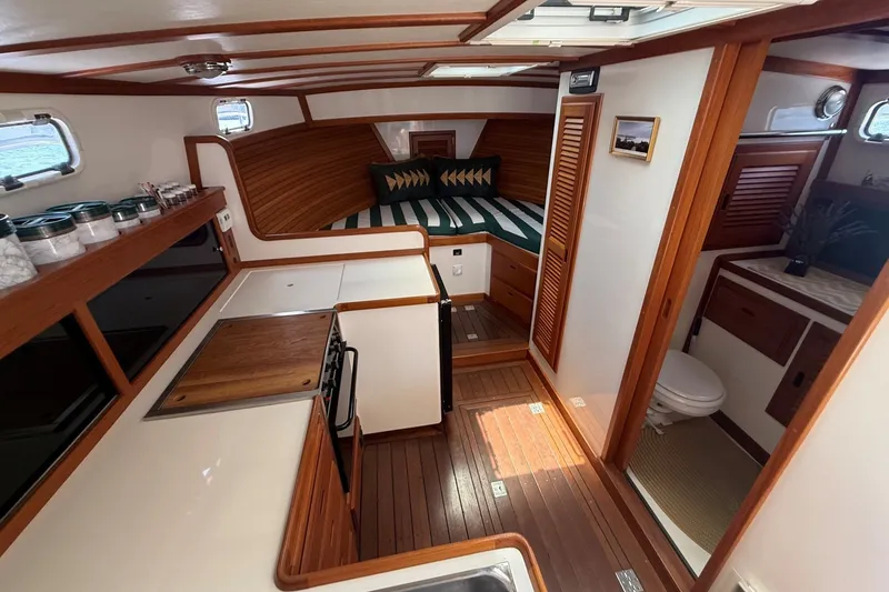 Slide: The Image of Interior of 2003 Ellis 36 Express Cruiser with kitchen, bed, and bathroom. - 25