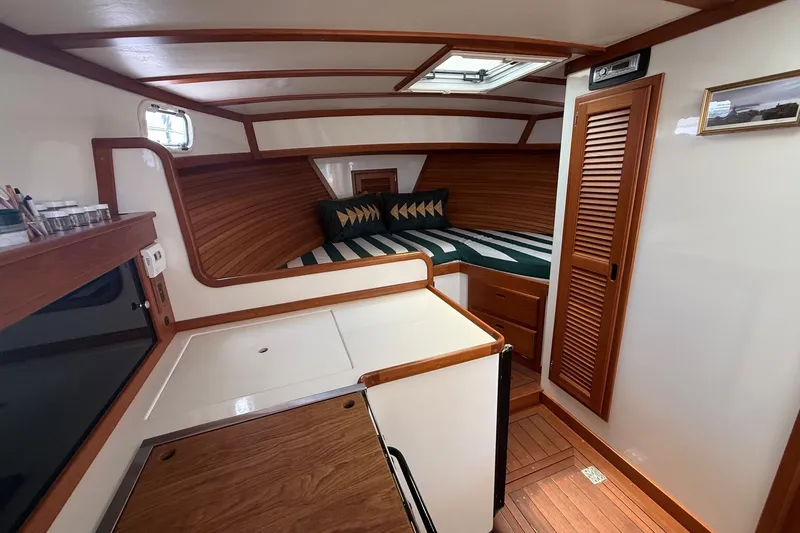 Slide: The Image of Interior of 2003 Ellis 36 Express Cruiser with cozy cabin and wooden finishes. - 26