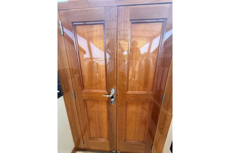 Slide: The Image of Wooden cabin door on a 2003 Ellis 36 Express Cruiser boat. - 41