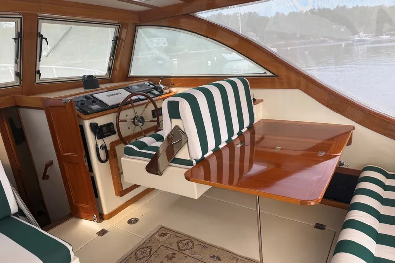 Slide: The Image of Interior of 2003 Ellis 36 Express Cruiser with striped seating and wooden accents. - 39