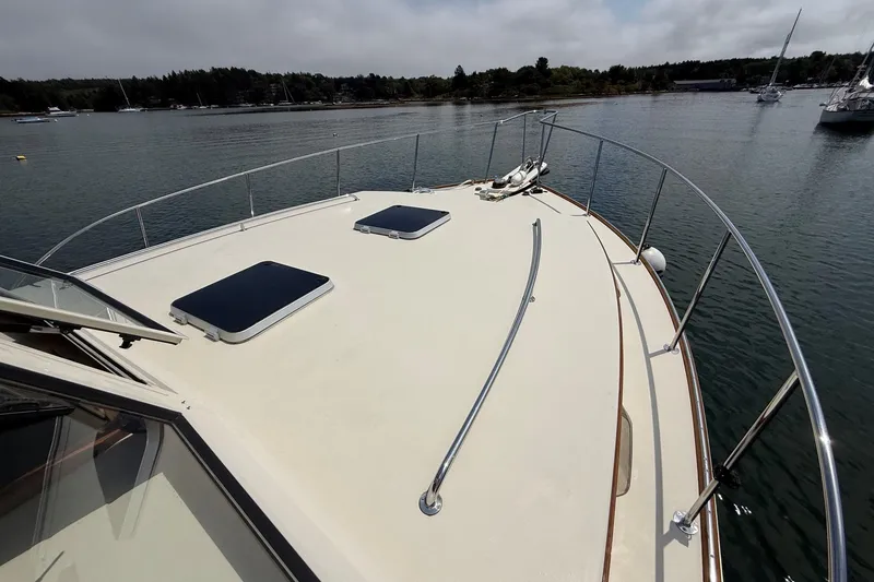 Slide: The Image of 2003 Ellis 36 Express Cruiser deck view on calm water. - 12