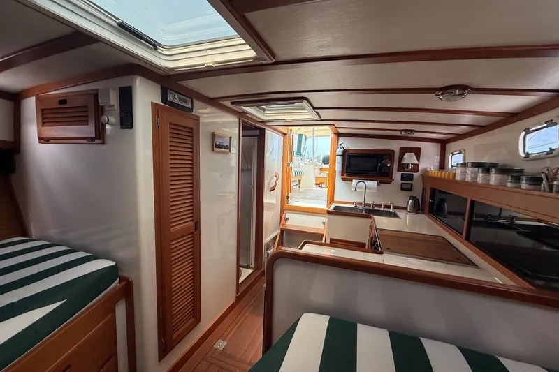Slide: The Image of Interior of 2003 Ellis 36 Express Cruiser with wood accents and modern amenities. - 24