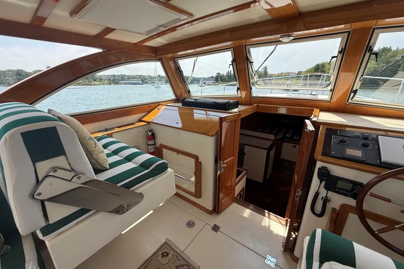 Slide: The Image of Interior of 2003 Ellis 36 Express Cruiser with striped seating and wooden accents. - 19