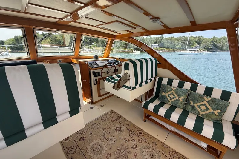 Slide: The Image of Interior of 2003 Ellis 36 Express Cruiser with striped seating and scenic water view. - 18